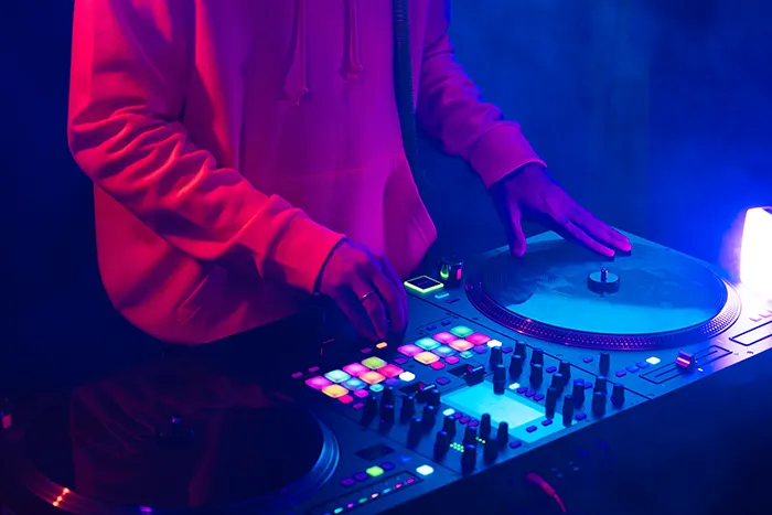 a dj is playing the turntables